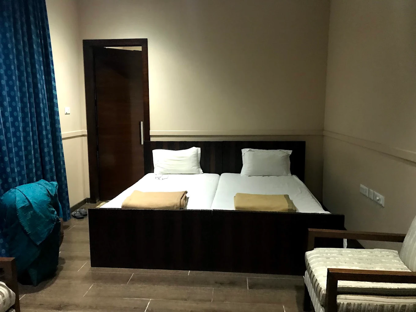 Twin bed guest room at Aditya Birla Nilayam